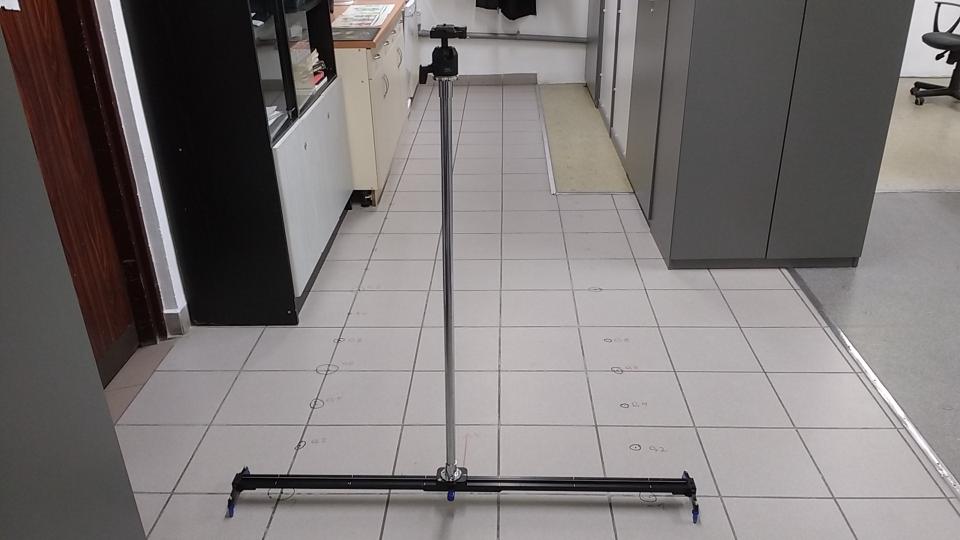 Camera rig. Rail, cart, pole and a camera mount.